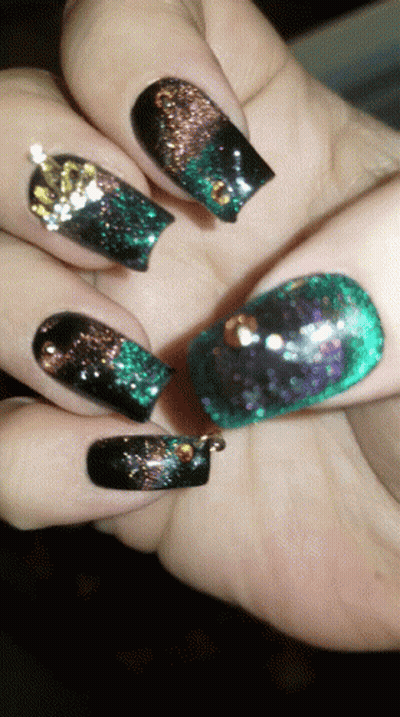 Close Up Of Nails With Black And Green Polish GIF