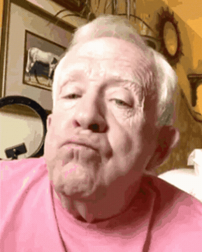 Close Up Of Older Man In Blue Shirt GIF