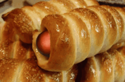 Close Up Of Pastry With Hot Dog Inside GIF