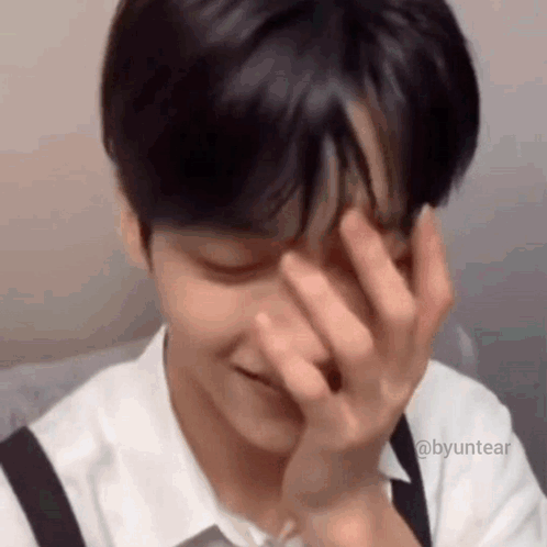 Close Up Of Person Covering Face With Hands GIF