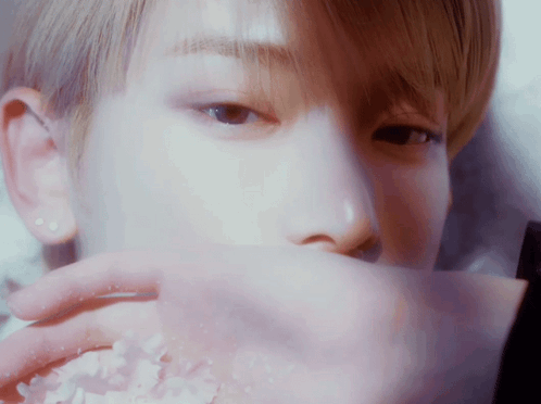 Close Up Of Person Covering Mouth With Paper GIF