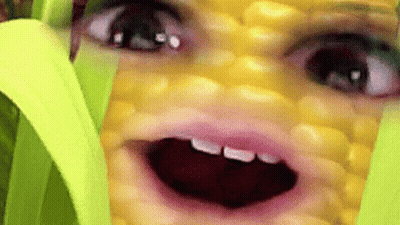 Close Up Of Person Face On Corn Cob Mouth Open GIF