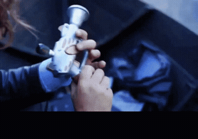 Close Up Of Person Holding Gun GIF