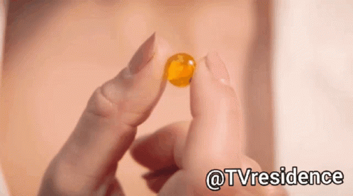Close Up Of Person Holding Pill With Hashtag @Tvresidence GIF