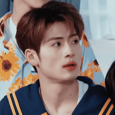 Close Up Of Person In Blue Shirt With Yellow Flowers GIF