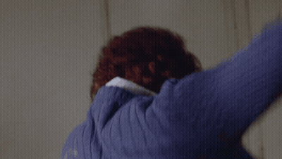 Close Up Of Person In Blue Sweater GIF