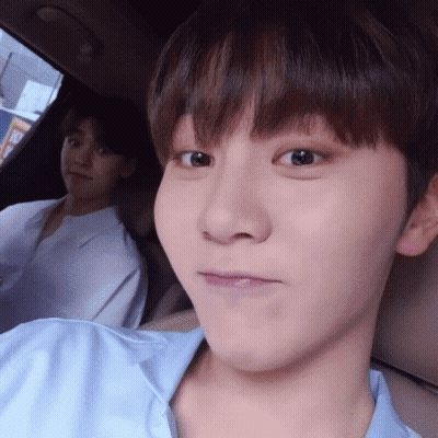 Close Up Of Person In Car With Another In Background GIF