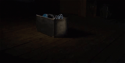 Close Up Of Person In Dark With Mask GIF