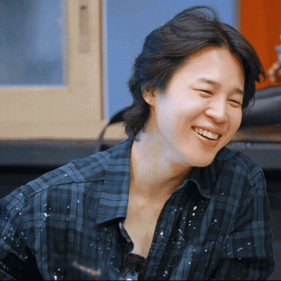 Close Up Of Person In Plaid Shirt Smiling GIF