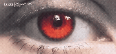 Close Up Of Person's Eye With Red Pupil GIF