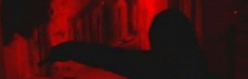 Close Up Of Person's Eyes In Red Light GIF