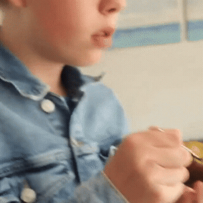 Close Up Of Person's Face And Hands GIF
