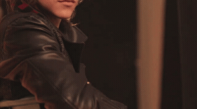 Close Up Of Person's Face In Black Leather Jacket GIF