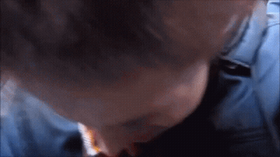 Close Up Of Person's Face In Blue Shirt GIF