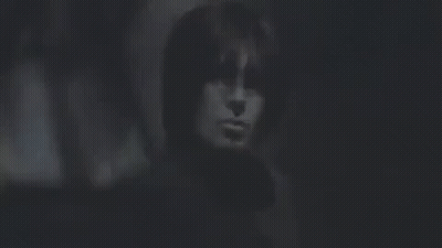 Close Up Of Person's Face In Dark GIF