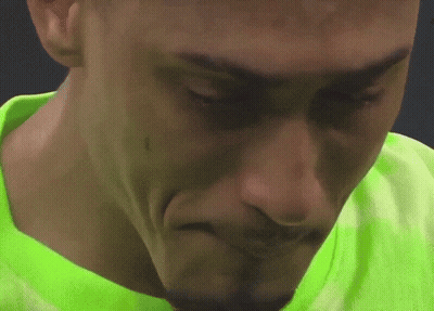 Close Up Of Person's Face In Green Shirt GIF