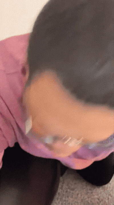 Close Up Of Person's Face In Pink Shirt GIF