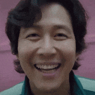 Close Up Of Person's Face On Pink Background GIF