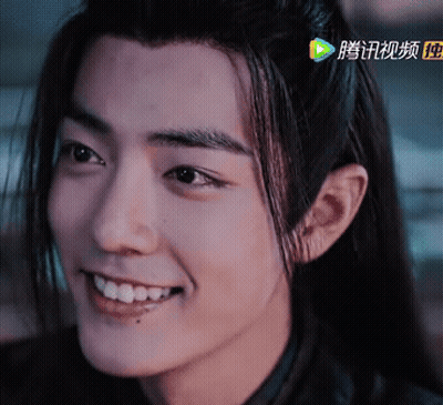 Close Up Of Person's Face With Chinese Writing GIF