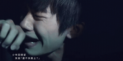 Close Up Of Person's Face With Chinese Writing GIF