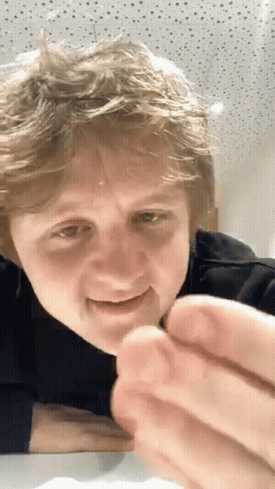 Close Up Of Person's Face With Dotted Ceiling GIF