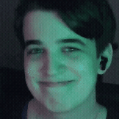 Close Up Of Person's Face With Green Light GIF