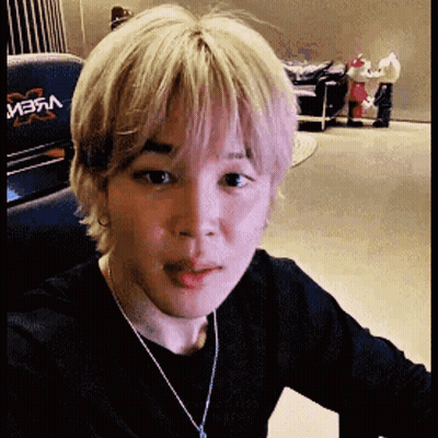 Close Up Of Person's Face With Necklace GIF