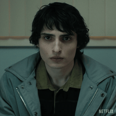 Close Up Of Person's Face With Netflix Logo GIF