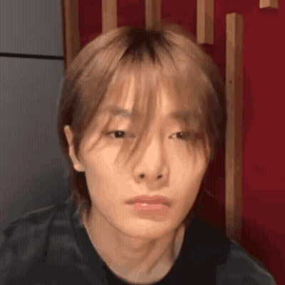 Close Up Of Person's Face With Red Background GIF