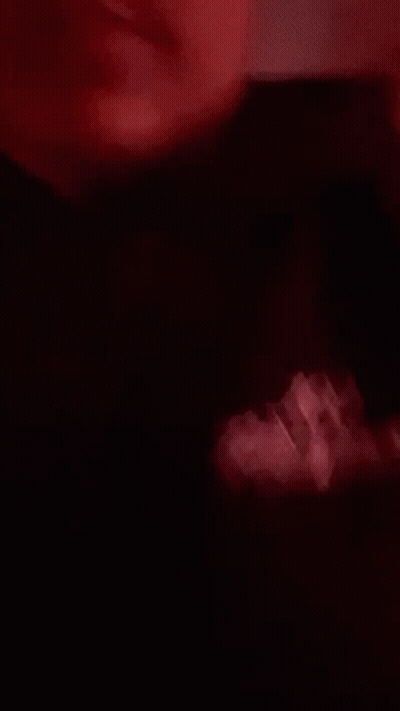 Close Up Of Person's Face With Red Light GIF