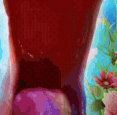 Close Up Of Person's Mouth With Purple Object GIF