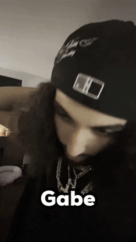 Close Up Of Person Wearing Black Beanie With Gabe GIF