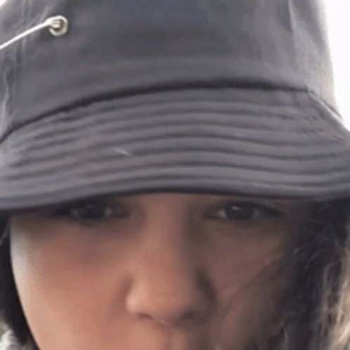 Close Up Of Person Wearing Hat With Rope Coming Out GIF