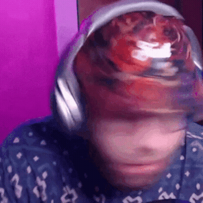 Close Up Of Person Wearing Headphones And Hat With Ball GIF