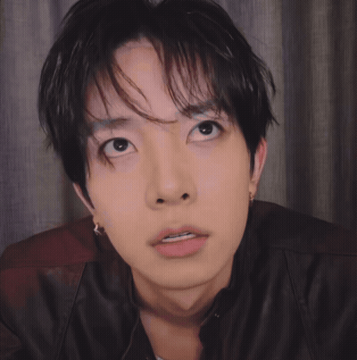 Close Up Of Person With Black Hair And Brown Jacket GIF