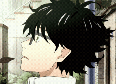 Close Up of Person With Black Hair and Green Eyes