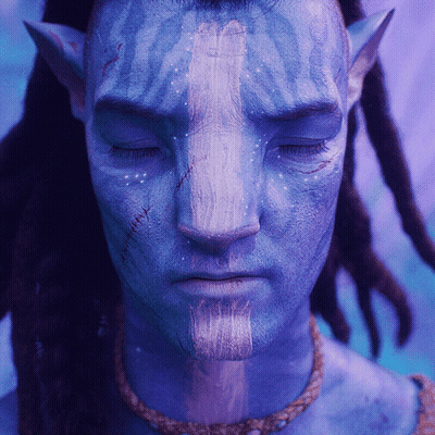 Close Up Of Person With Blue Face Paint GIF