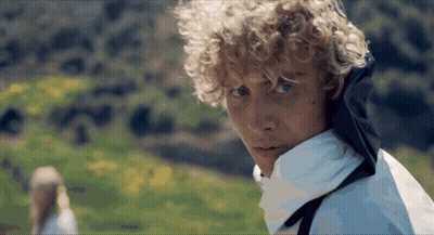 Close Up Of Person With Curly Blonde Hair GIF