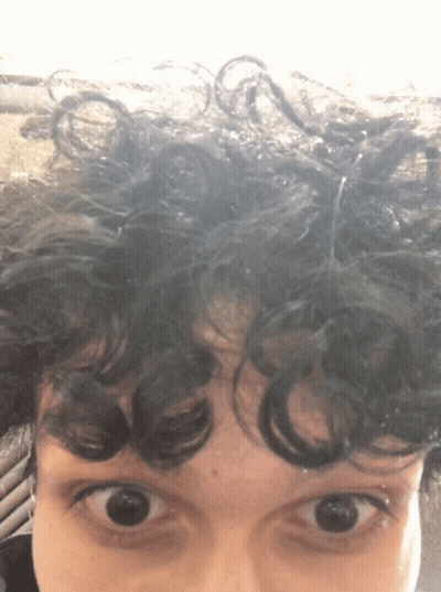Close Up Of Person With Curly Hair GIF