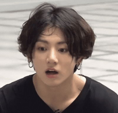 Close Up Of Person With Earrings And Black Shirt GIF