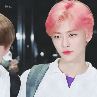 Close-Up Of Person With Purple Shirt And Pink Hair GIF