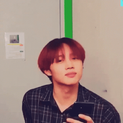 Close Up Of Person With Red Hair And Green Background GIF