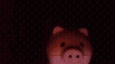 Close Up Of Piggy Bank In The Dark GIF