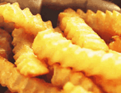 Close Up Of Pile Of French Fries GIF