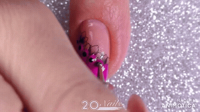 Close-Up Of Pink Nail Polish Design GIF