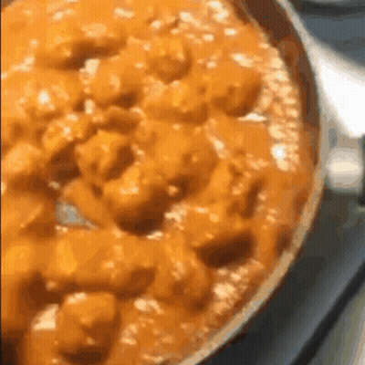 Close Up Of Pizza In Pan On Stove GIF