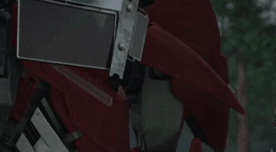 Close Up Of Robot Head With Blue Eyes GIF