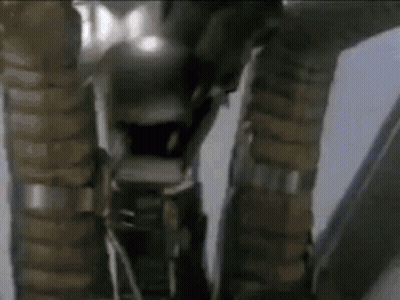 Close Up Of Robot Legs And Arms In Room GIF