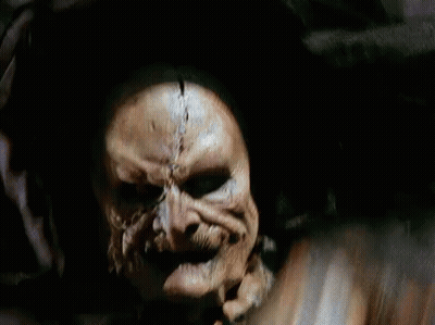 Close Up Of Skeleton Face In Dark Room GIF