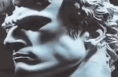 Close Up Of Statue Man Face Against Dark Background GIF